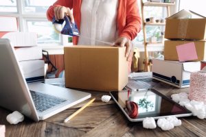 Business Start up SME concept. Young startup entrepreneur small business owner working at home, packaging and delivery situation.